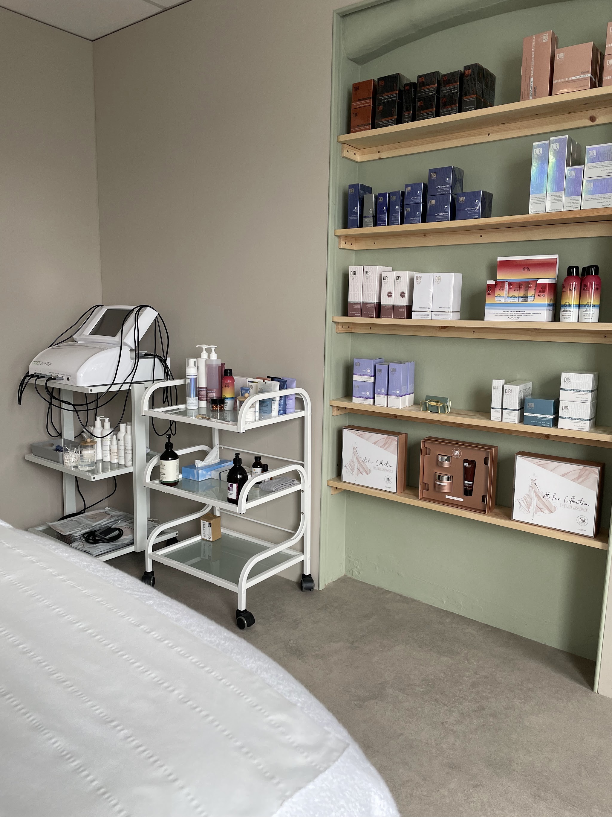 Shelves of professional skincare beside the treatment couch